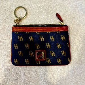 Dooney and Bourke navy zipper change purse with key fob. Never used